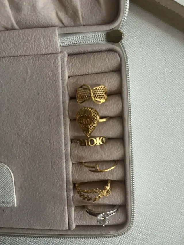 Gold rings arranged in a jewellery case